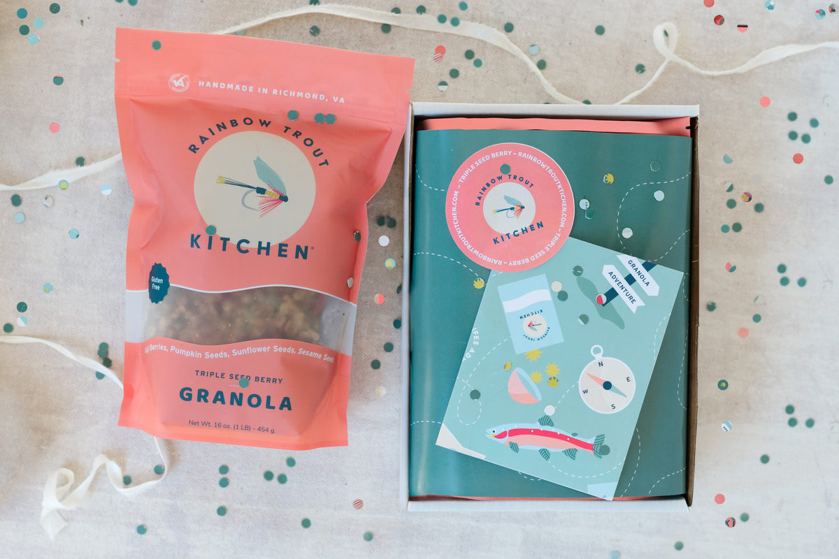 Birthday gift box with a bag of Triple Seed Berry granola, a greeting card and confetti